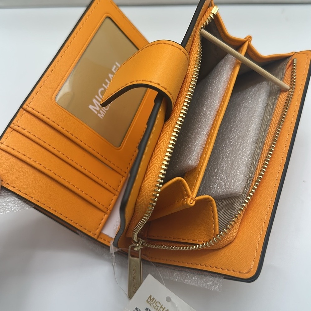 Michael Kors Jet Set Travel Medium Printed Signature Logo Bi-Fold 
Pop Orange - Picture 12 of 14